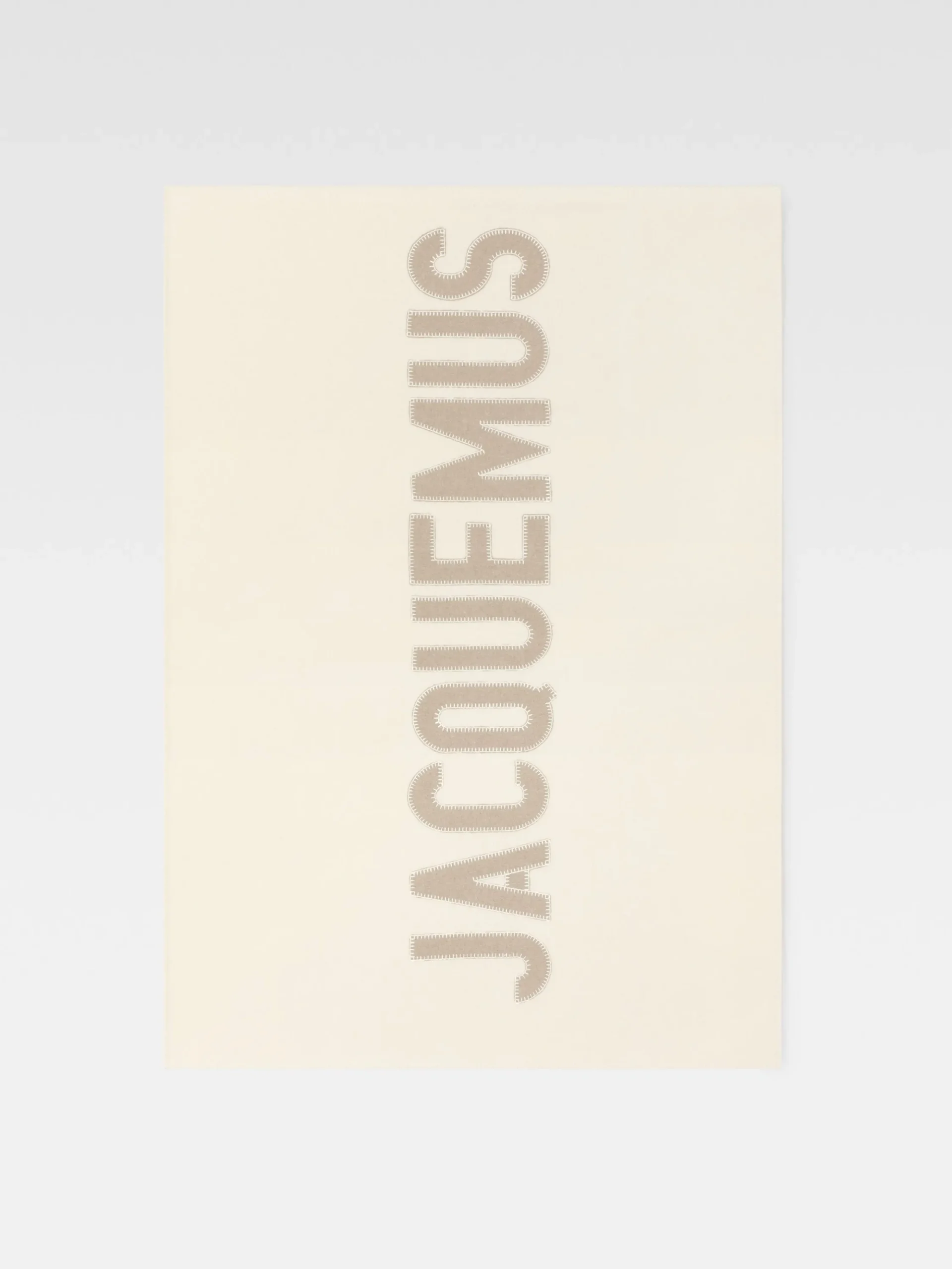 The embroidered Jacquemus plaid